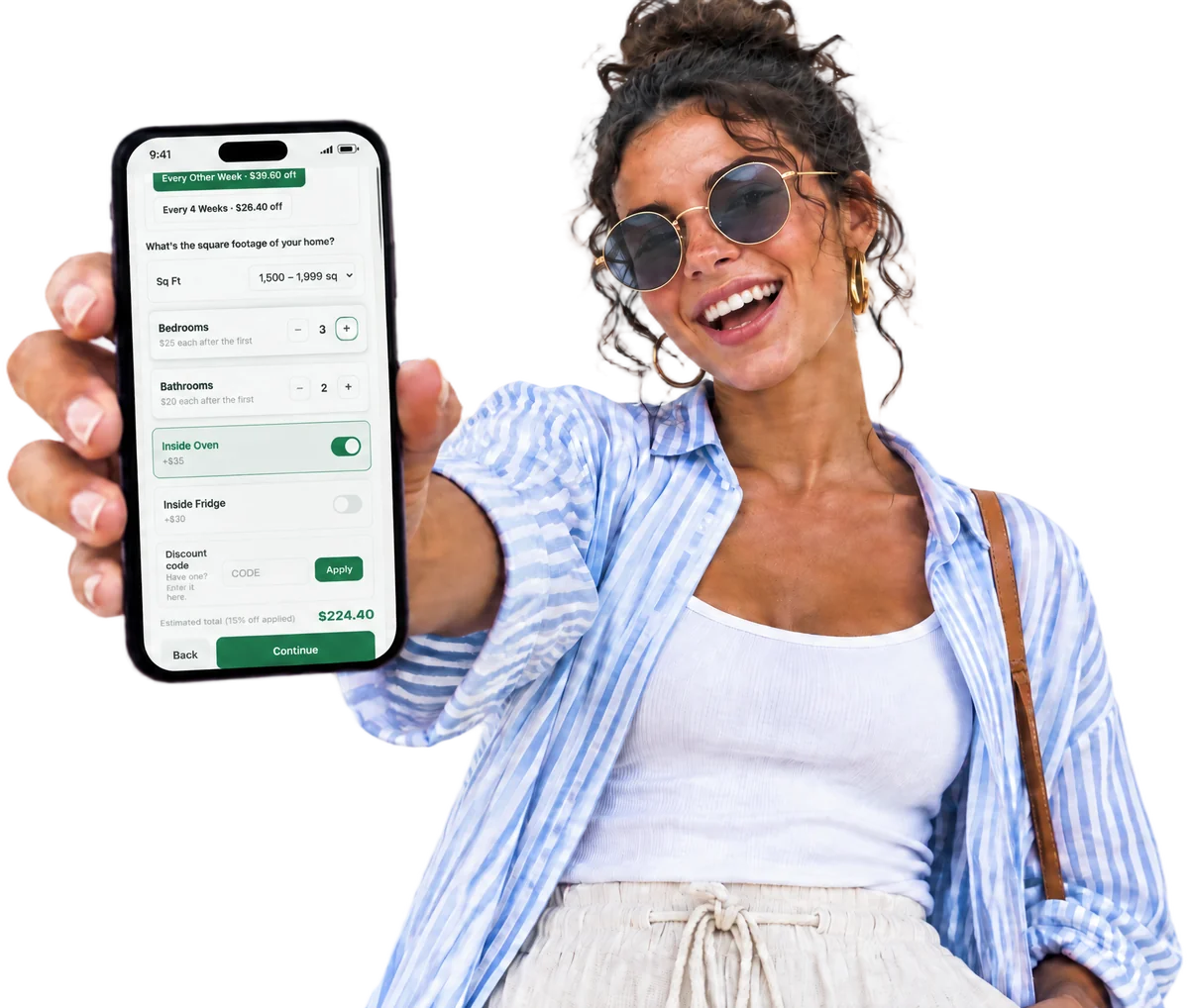 A smiling woman holds up a phone showing a BookedEZ booking page with a $224.40 estimated total